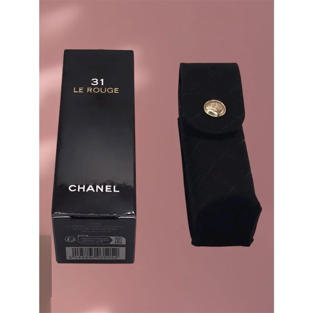 Chanel 31 Le Rouge lipstick case, a black quilted velvet pouch.